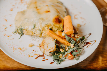 Chicken parmigiana. Traditional Italian comfort dish. Chicken breast covered in breadcrumbs fried,...