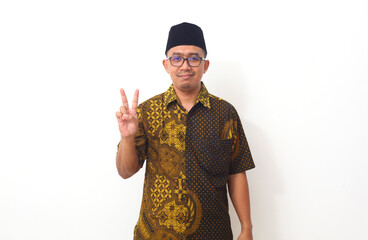 Portrait of Asian man standing and showing two finger. Isolated on white background with copyspace