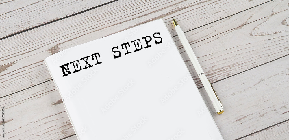 Poster notepad with text next steps . white background. business concept