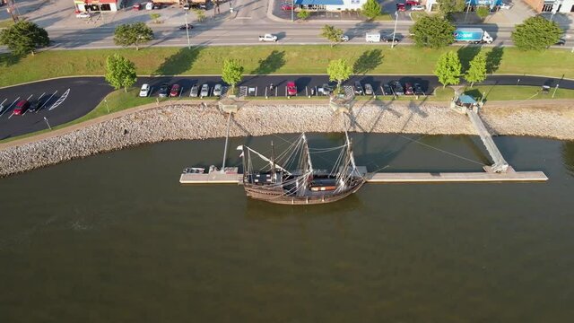 Aerial boomerang shot of the Pinta replica, revealing the Cumberland River and Clarksville, Tennessee