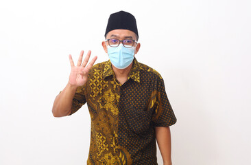 Portrait of Asian man standing and showing four finger. Isolated on white background with copyspace