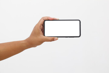 Man's hand holding the black smartphone with blank screen and modern frameless design. Isolated on white background.