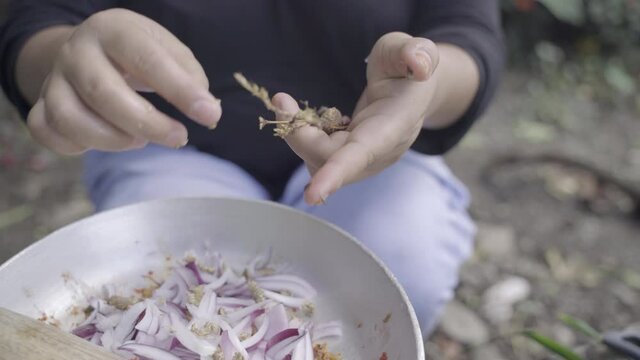 Local wild herb Lomba, elsholtzia griffithii, is added to chutney dish