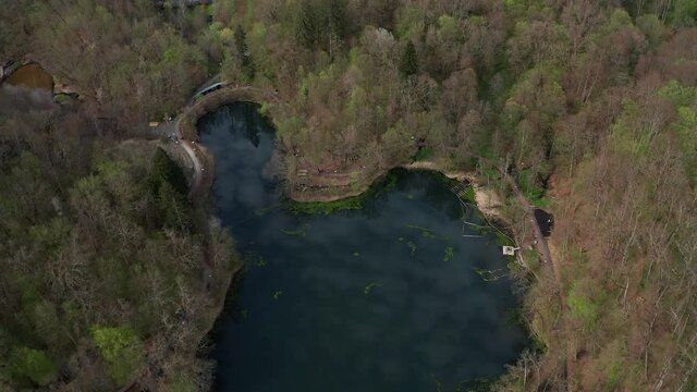 Ursu Lake (Bear Lake) Surrounded With Trees In The Forest In Sovata, Romania. - aerial
