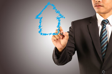 businessman drawing house