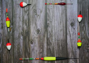Flat lay fishing floats lie on dark gray boards © Uri