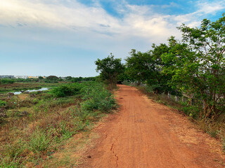 Fototapeta na wymiar River View Mud Road and beautiful sky in Chennai