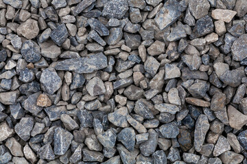 brick rubble debris on construction site. inorganic crushed stone, non-round, loose material with grains. Artificially obtained by crushing coarse-grained rocks and pebbles, accidentally mined