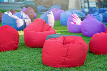 Colorful bean bag chairs to relax outdoor placed due to social distancing during coronavirus...