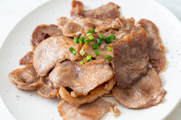 grilled pork neck sliced on plate