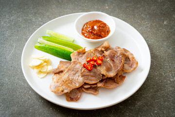 grilled pork neck sliced on plate