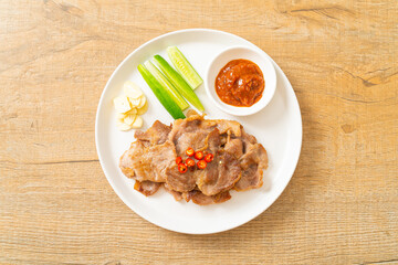 grilled pork neck sliced on plate