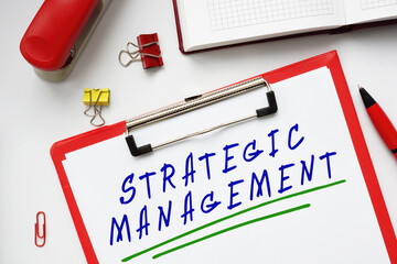 Financial concept meaning STRATEGIC MANAGEMENT with inscription on the piece of paper.