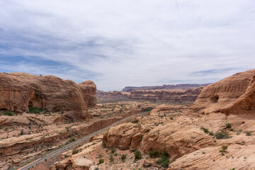 Train track running through valley in Utah desert