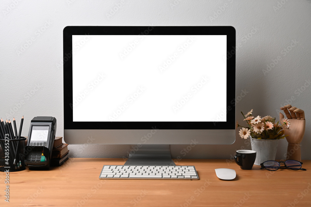 Poster front view mock up computer with empty screen on wooden desk.