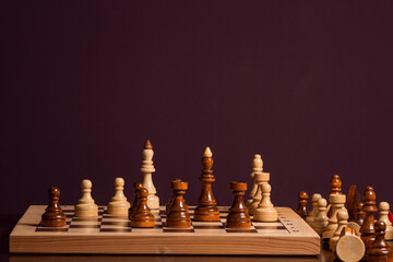 chess pieces on a chessboard on a dark background