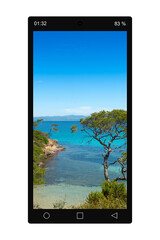 Closeup of a black cellphone with a photo of an idyllic summer landscape, isolated on white background