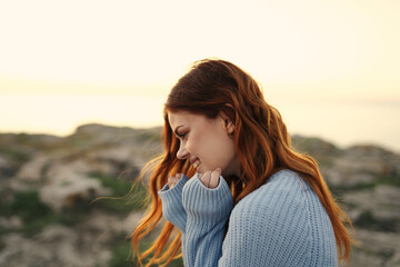 redheaded woman outdoors rocky mountains landscape nature travel