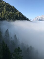 Clouds moving around mountains