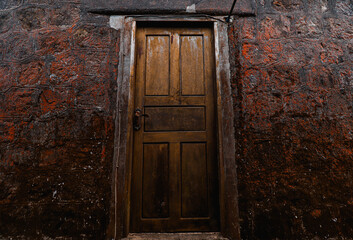 Old door of Sampov Pram Pagoda in the Bokor National Park in Kampot, Cambodia
