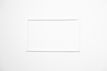 minimal background concept with white paper frame on blank white paper.