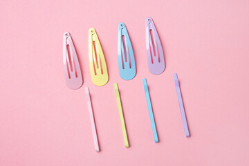 Group of colorful pastel color Hair Clips on Pink Background, Styled Shot,modern accessories for...