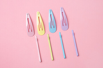 Group of colorful pastel color Hair Clips on Pink Background, Styled Shot,modern accessories for hair
