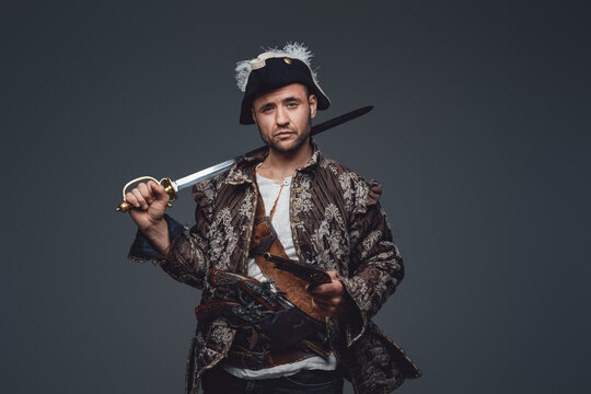 Medieval corsair pirate with saber and pistol