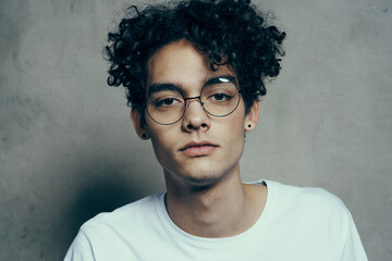 man with curly hair cropped look glasses fashion studio