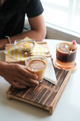 Espresso coffee mixed with lychee juice on the table. Various fruits mixed with coffee, good taste, fragrant, mellow, giving a fresh feeling Healthy drink concept