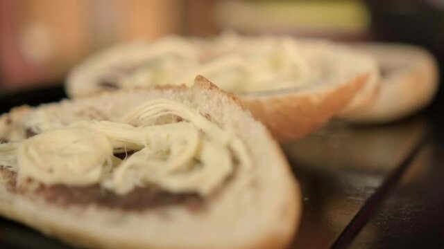Close-up of three traditional Mexican molletes on a black tray