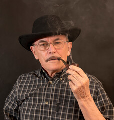 Cowboy in hat with Pipe