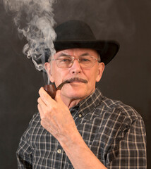 Cowboy in hat with Pipe