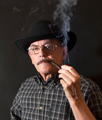 Cowboy in hat with Pipe