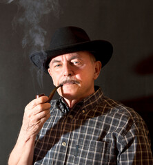 Cowboy in hat with Pipe