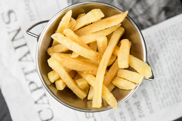 French fries in a metal bucket