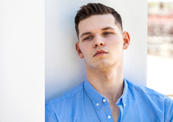 Portrait of a young man in a blue shirt