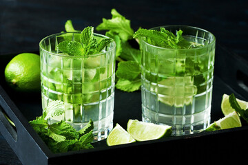 Mojito cocktail, iced drink with lime and mint