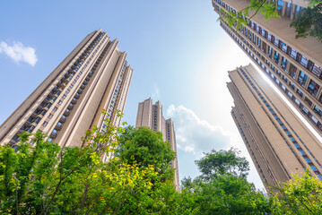 China's multi-storey buildings and high-rise residential houses.New residential building with blue sky and trees in China.China residential property markets.China real estate.
