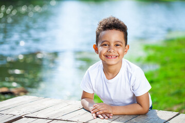 Five year old little boy in summer park