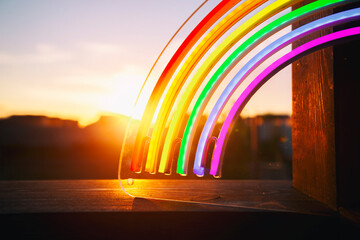 The led neon rainbow at the sunset