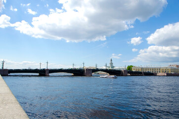 Fototapeta na wymiar View of the Neva River and the Palace Bridge in Saint Petersburg, Russia