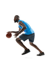 Full length portrait of a basketball player with a ball isolated on white studio background. advertising concept. Fit african american athlete jumping with ball.