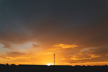 sunset and radio pole structure