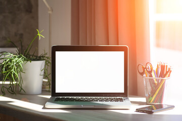 Blank laptop screen. Work or study online from home at a desk and laptop.. 