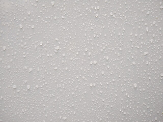 Water droplets on white board, background image
