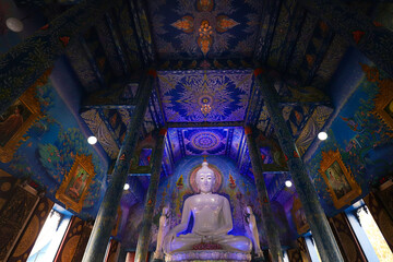Fototapeta na wymiar Low angle view inside the famous Wat Rong Suea Ten or Blue Temple in Chiang Rai, Thailand