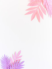 Summer background with colorful paper tropical leaves.