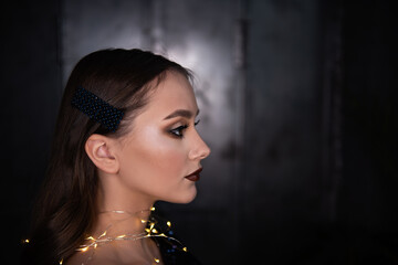 Close-up portrait of beautiful girl with an evening festive, professional make-up, bright, shiny...