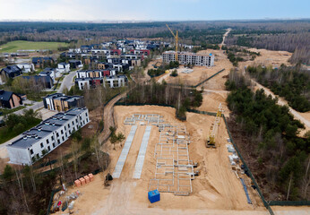 Сonstruction site with foundation pit to Build a New House. First floor slab rebar installation. Home building and city construction concept. Country housing in a forest area.